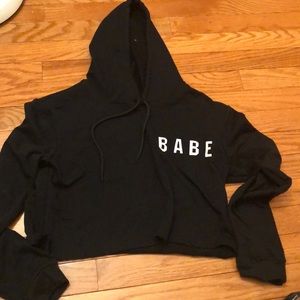 a cropped black hoodie